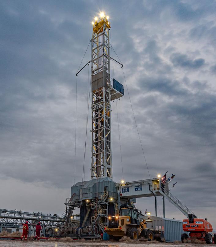 Geothermal drilling rig operating at a well site